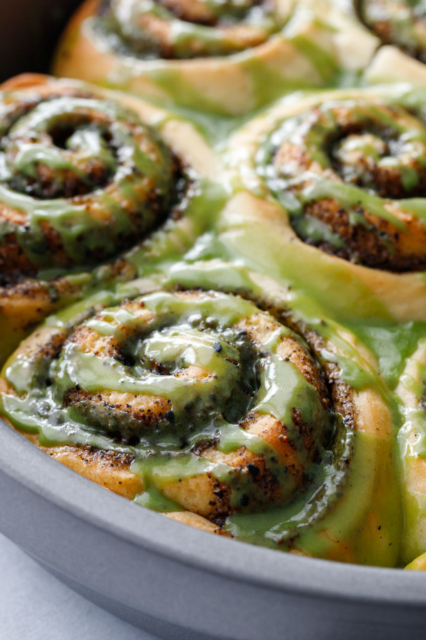 Close up on Black Sesame Cinnamon Rolls with Matcha Glaze