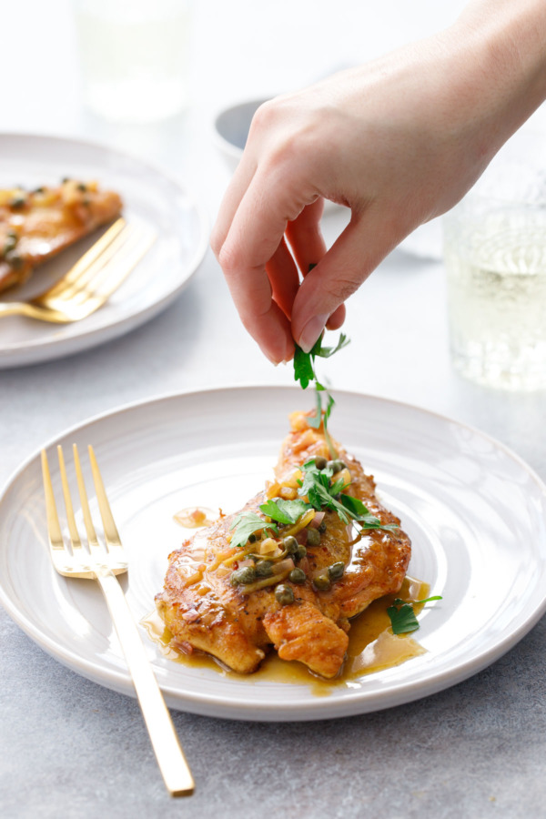 Chicken Picatta topped with preserved lemon, capers and fresh parsley.