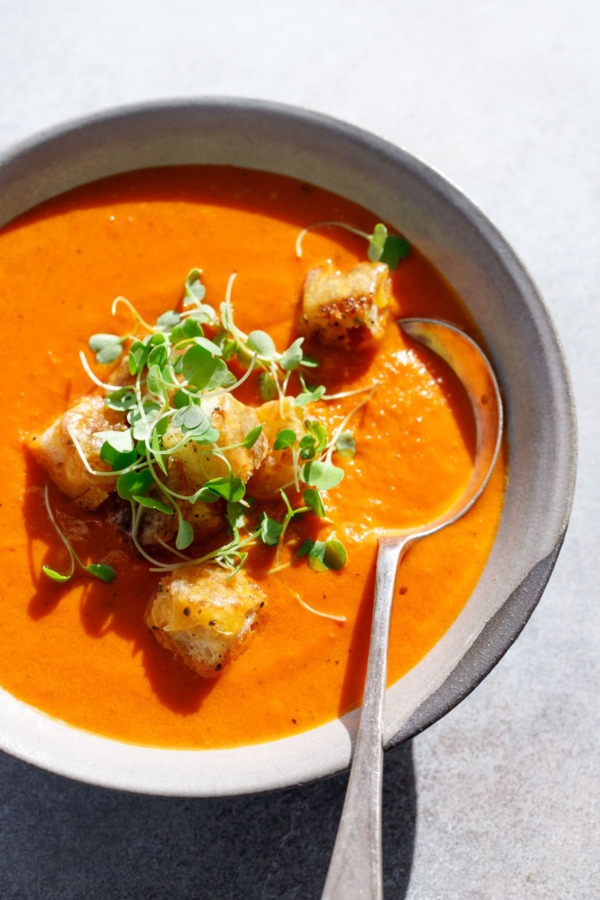 The Best Tomato Soup using canned tomatoes, topped with cheesy croutons!