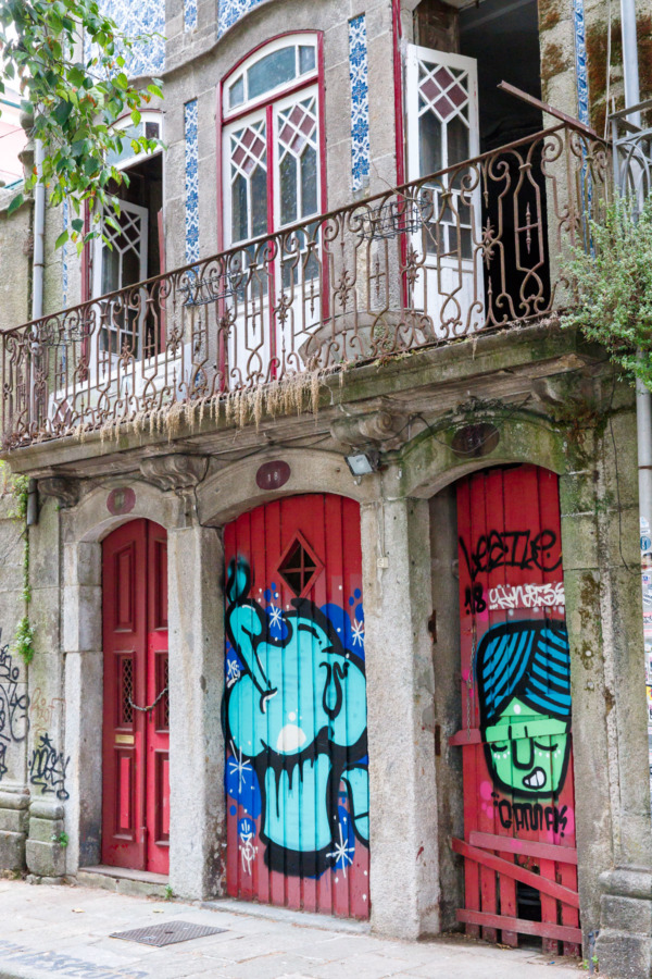 Red doors and colorful graffiti, Porto, Portugal