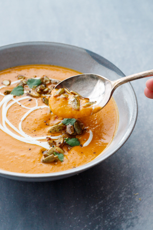 Dive in to this bowl of creamy butternut squash soup, topped with maple roasted pumpkin seeds.