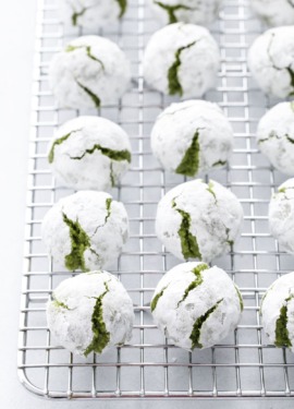 Matcha Amaretti Cookies covered with powdered sugar