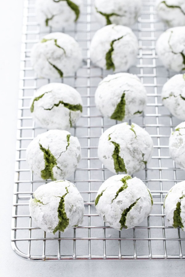 Matcha Amaretti Cookies covered with powdered sugar