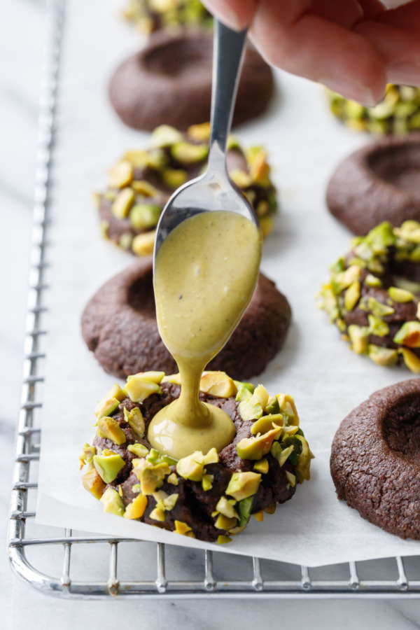 Chocolate shortbread thumbprints filled with salted pistachio cream