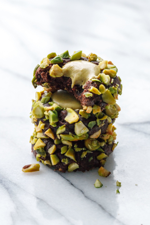 Chocolate Pistachio Cream Thumbprints, rolled in pistachios and filled with a salted pistachio gianduja