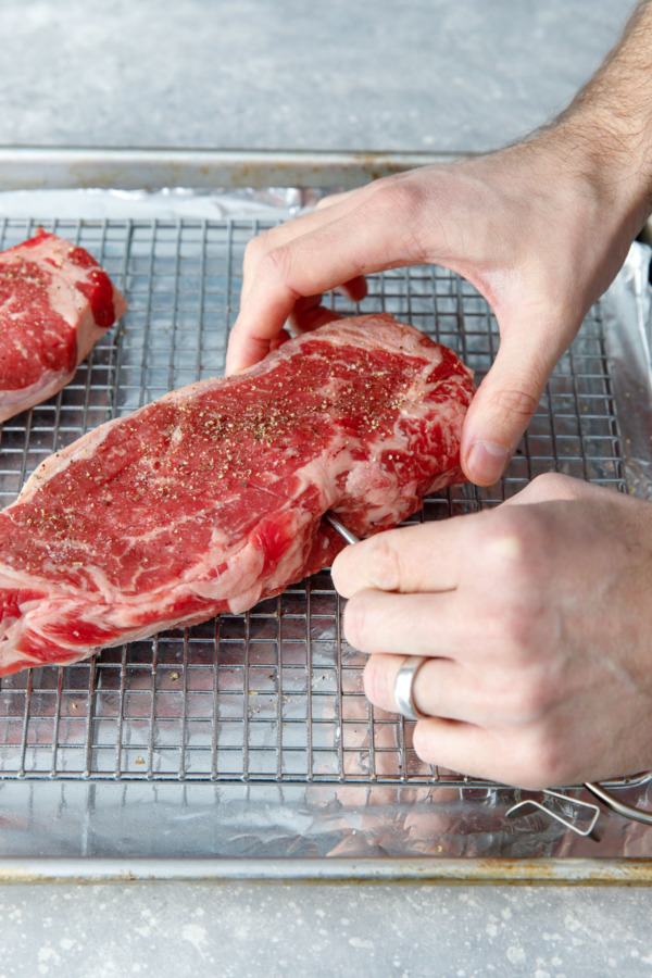 How to Cook Reverse-Sear Steaks: use a probe thermometer for accurate cooking.