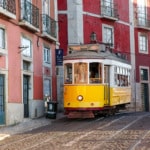 The historic yellow 28E tram line in the Alfama district of Lisbon, Portugal