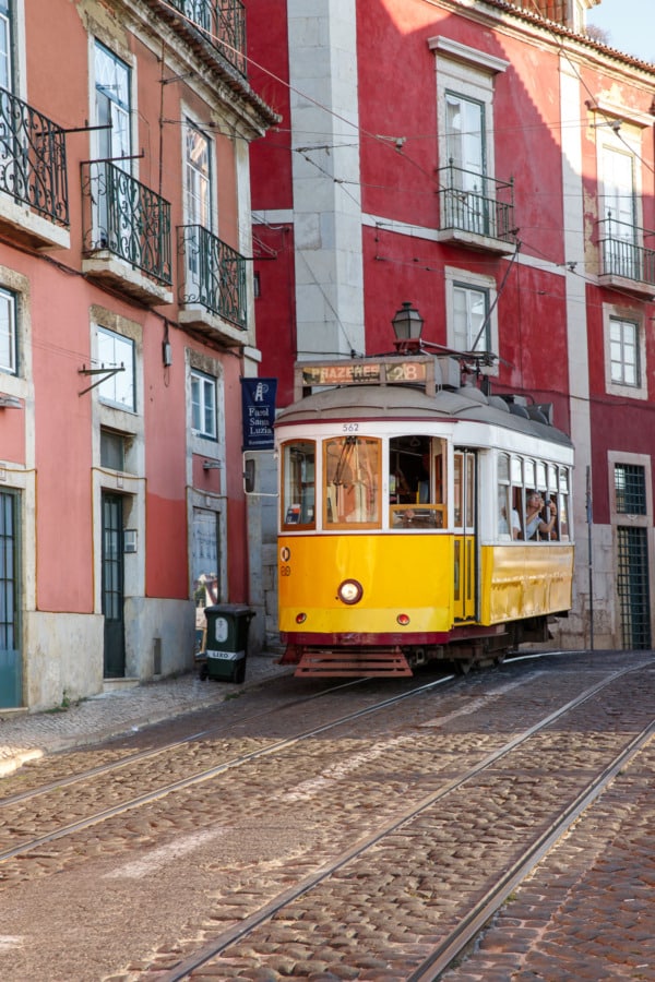 The historic yellow 28E tram line in the Alfama district of Lisbon, Portugal