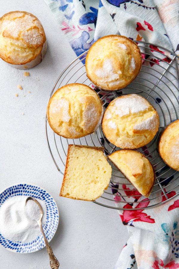 Overhead shot of rice muffins, with one cut in half showing the tender crumb.