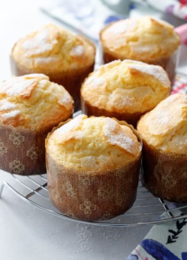 A wire cooling rack with freshly baked rice muffins on top