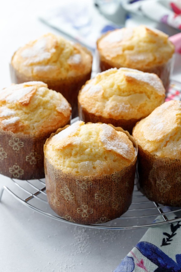 A wire cooling rack with freshly baked rice muffins on top