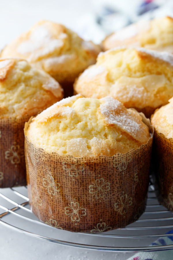 Closeup of freshly baked rice muffins, showing the crackly sugar topping.