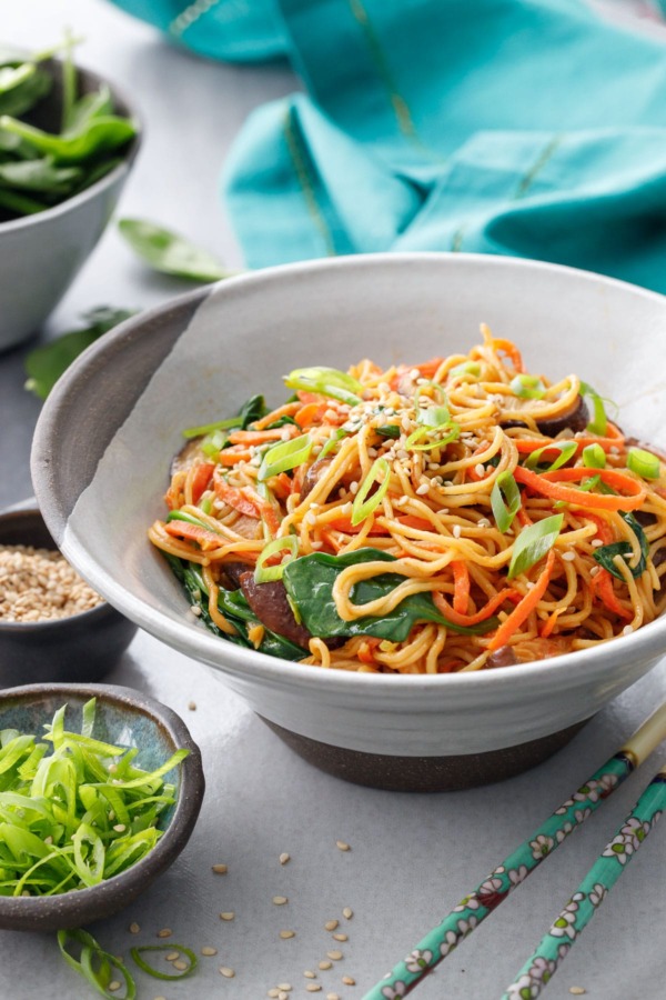 Bowl of Sesame Stir Fry Noodles with Mushrooms, Carrots and Spinach