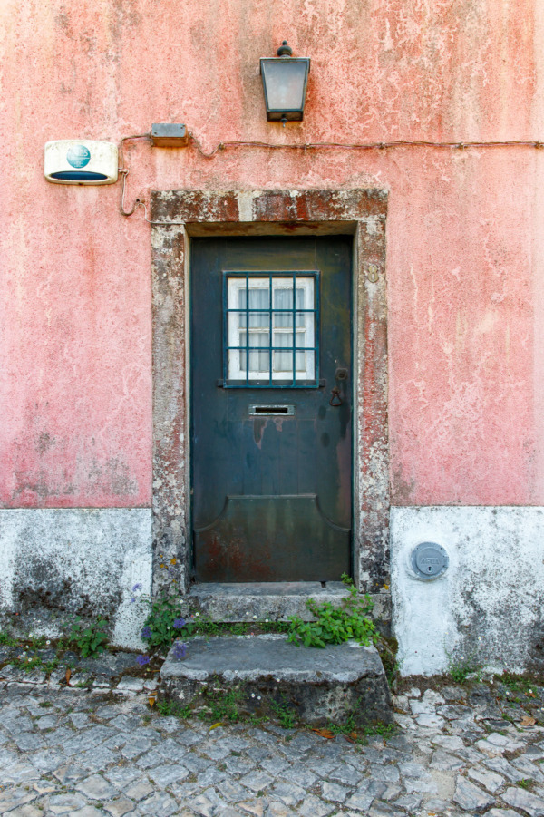 Pastel pink walls with a dark green door, Sintra, Portugal