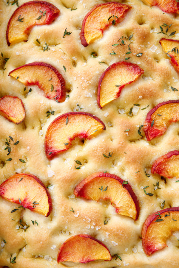 Closeup of the topping of Peach & Fresh Herb Focaccia Bread