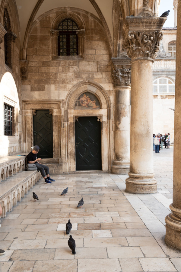 Portico with Tourist and Pigeons, Old Town Dubrovnik, Croatia