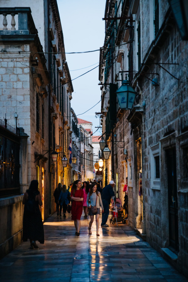 Narrow alleyway in Dubrovnik, Croatia at dusk.