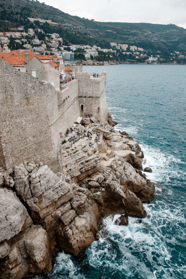 Looking down on a cliffside bar outside the walls of Dubrovnik, Croatia