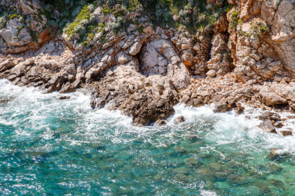 Rocky beach and turquoise waters, Dubrovnik, Croatia