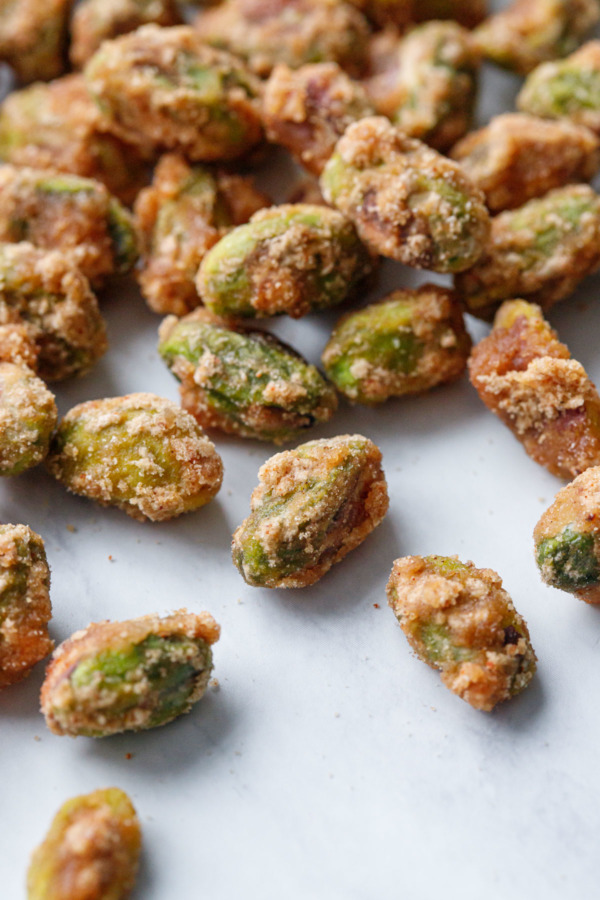 Extreme closeup showing the texture of the crystalized sugar on green pistachios.