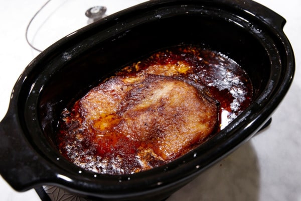 The final cooked brisket in a slow cooker
