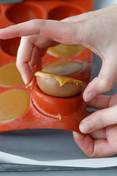 How-To Entremet Cake Process: after freezing, remove the cremeux/caramel dome from the silicone mold