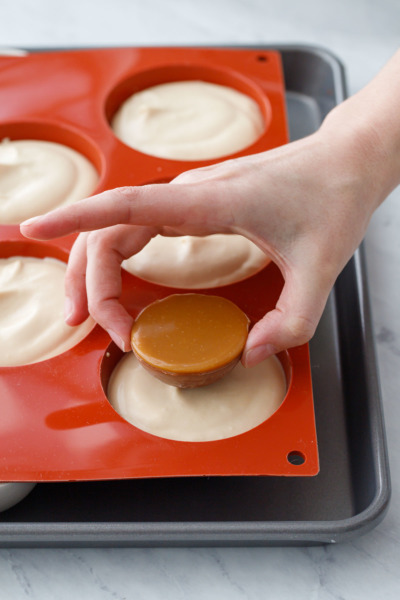 How-To Entremet Cake Process: place the cremeux dome in the middle of the caramel mousse.