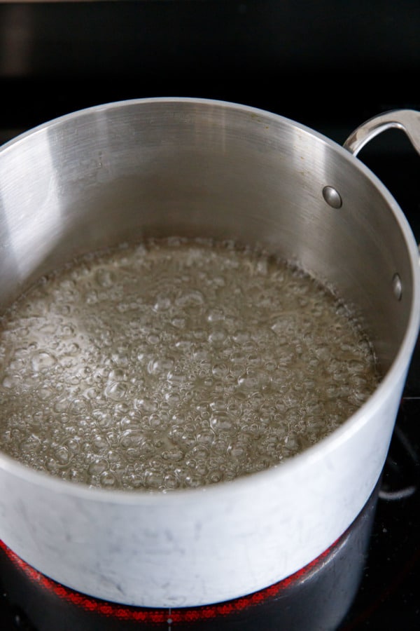 Making homemade caramel: cook the syrup in a light colored, heavyweight saucepan. It will start out clear in color.