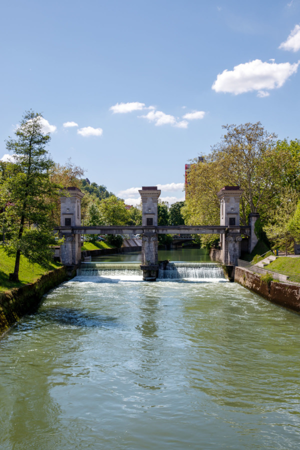 Ljubljanica River in Ljubljana, Slovenia and a Sluice Gate and Triumphal Arch designed by Jože Plečnik