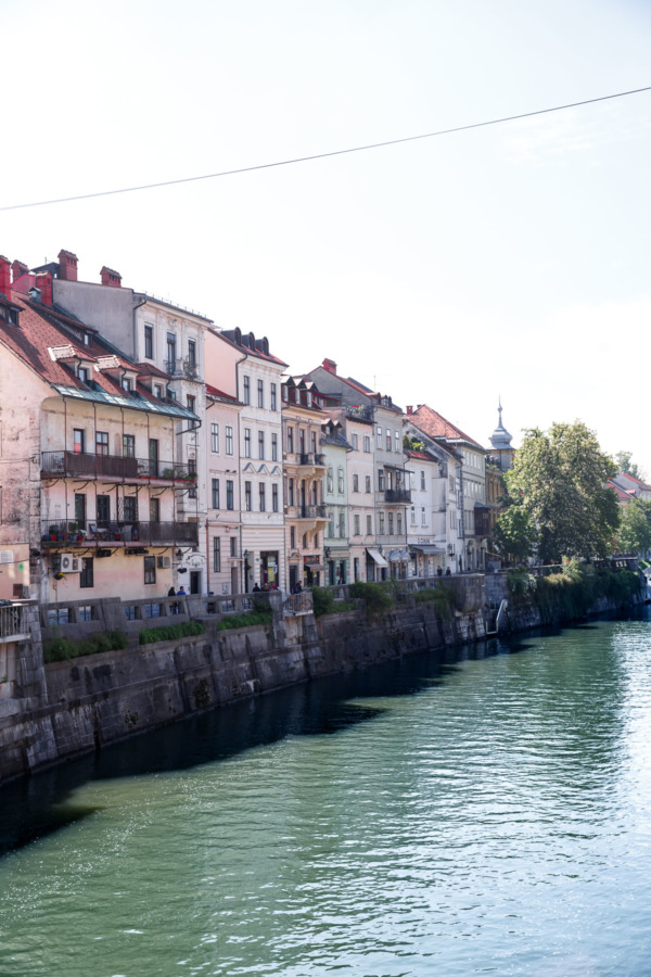 Pastel buildings along the river in Ljubljana, Slovenia