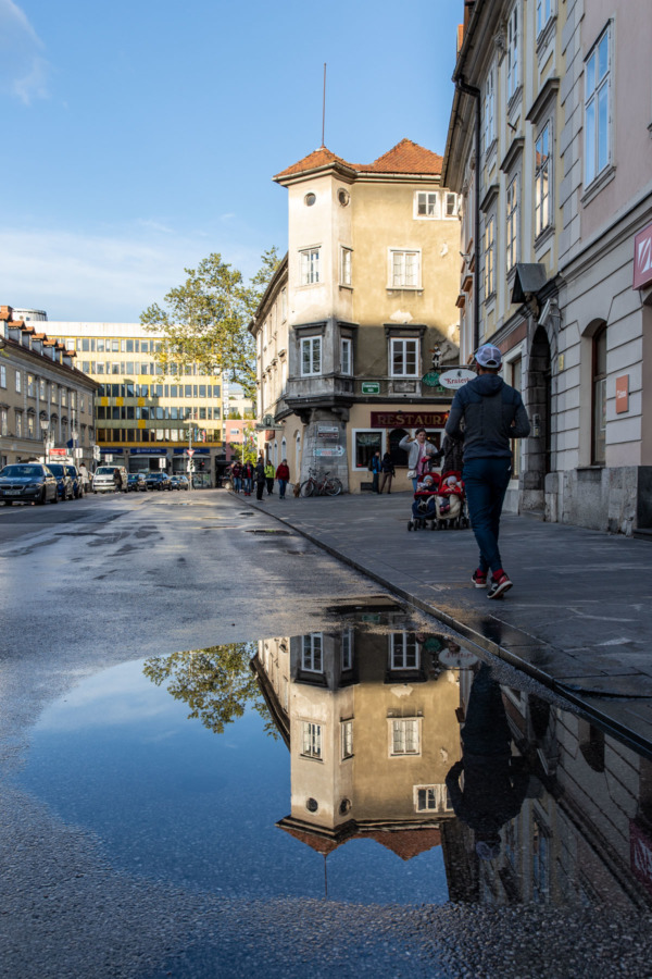 Reflection in a puddle on a street in Ljubljana, Slovenia