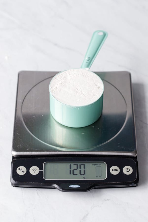 1 cup of flour measured using the spoon and sweep method weighs 120 grams.