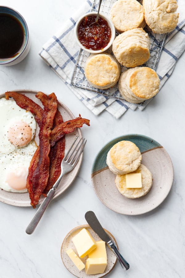 A full breakfast with bacon and eggs and sourdough biscuits