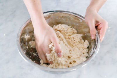 How to make Sourdough Biscuits: Fold dough a few times until it comes together (don't overwork it!)