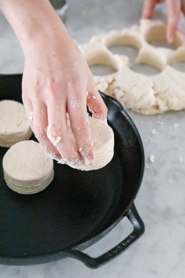 How to make Sourdough Biscuits: Place in a buttered cast iron skillet for even baking.