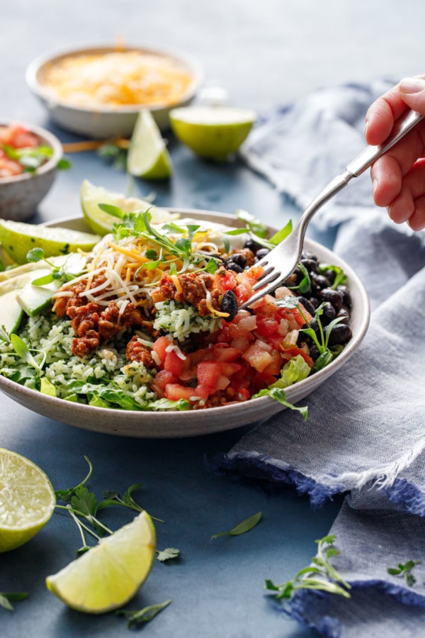 Fork lifting a scoop of Turkey Taco Bowls with Cilantro Rice