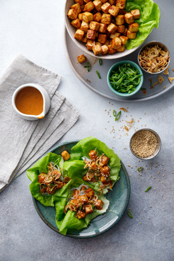 Overhead scene Baked Tofu Lettuce Wraps with Spicy Peanut Sauce