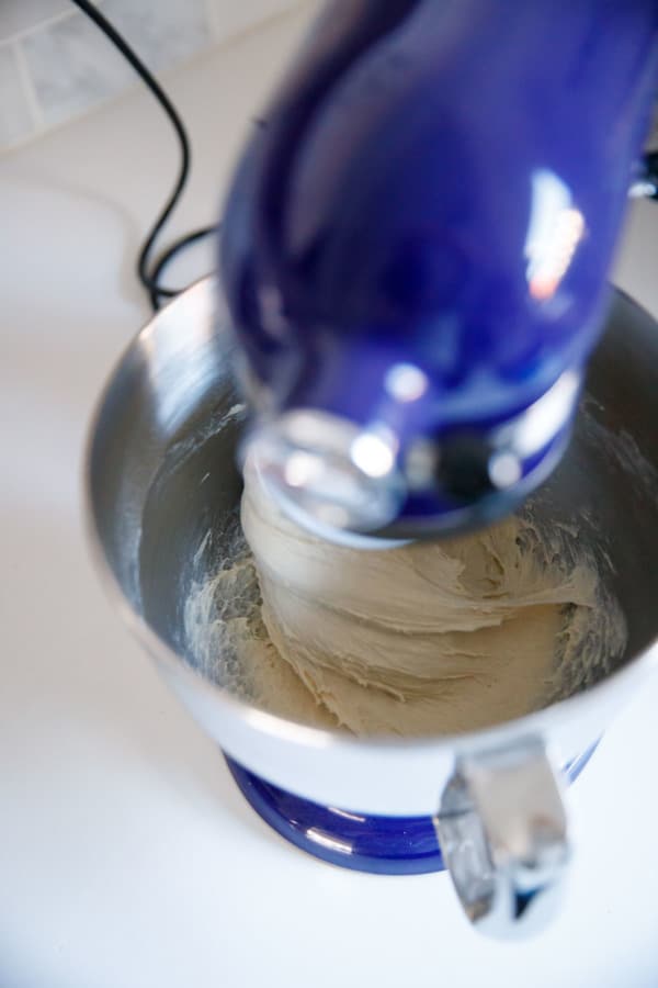 Mixing the pizza dough with a stand mixer.