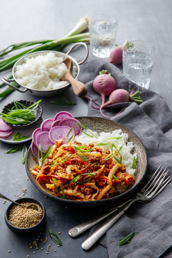 Spicy Korean Egg Roll Bowls with a bowl or rice and purple radishes