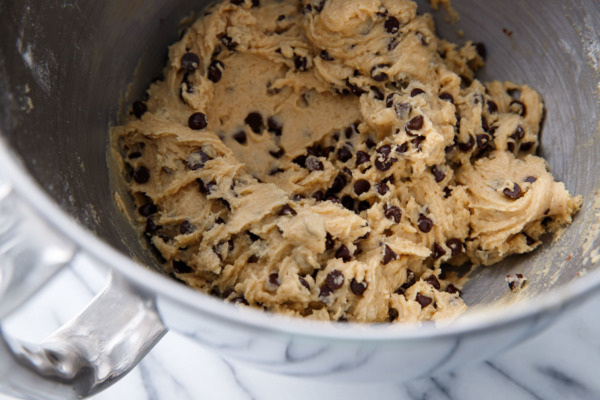 Metal bowl of raw chocolate chip cookie dough