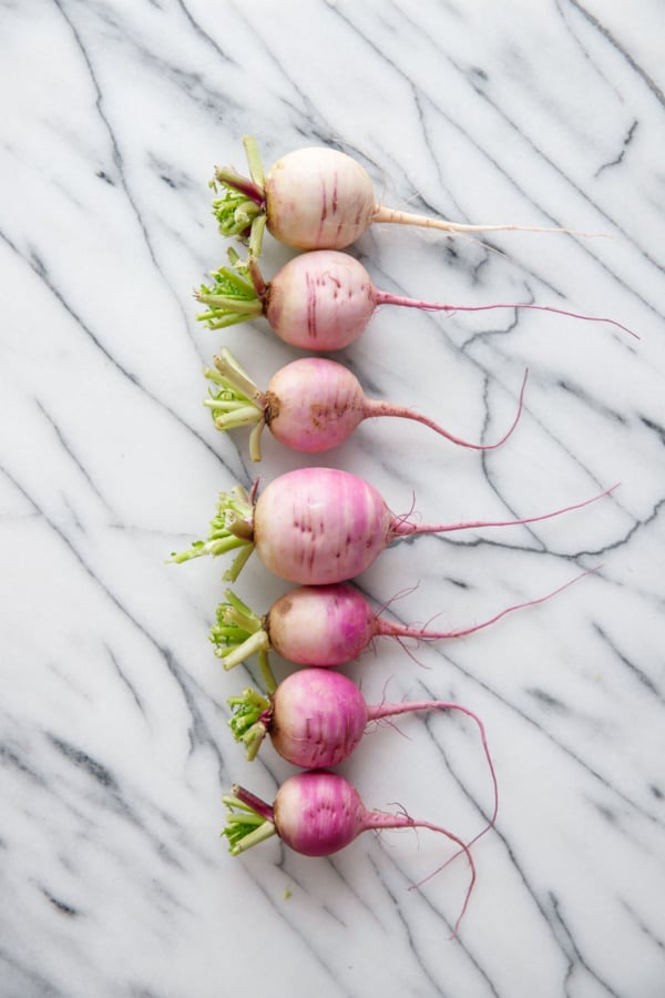 Gradient of Purple Daikon Radishes on marble