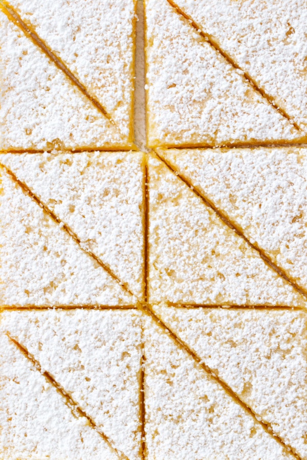 Meyer Lemon Bars sliced into triangles.