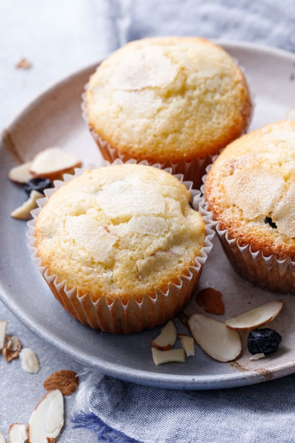 Plate with Three Sourdough Muffins with crackly sugar tops