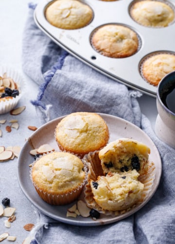 Plate of Sourdough Muffins with Dried Blueberries and Almonds, linen napkin and muffin tin