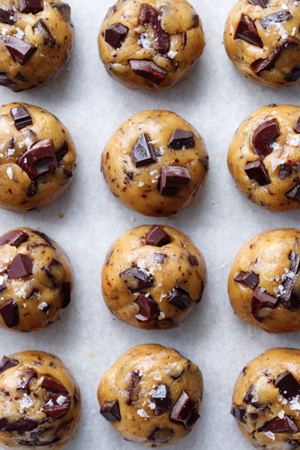Balls of unbaked Olive Oil Chocolate Chip cookie dough