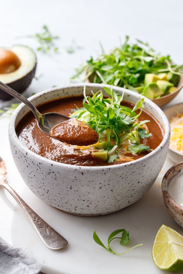 Spoonful of blackbean soup showing the thick, silky texture