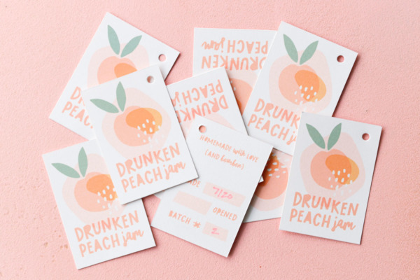 Printable hang tag labels for Drunken Peach Jam, showing front and back designs on a pink background.