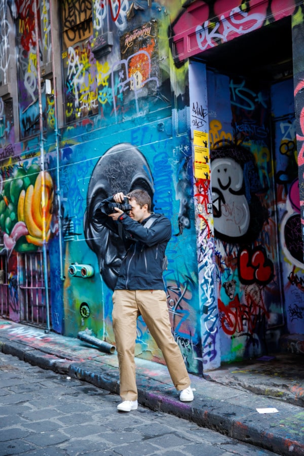 Taylor taking photos of Hosier lane graffiti, Melbourne, Australia