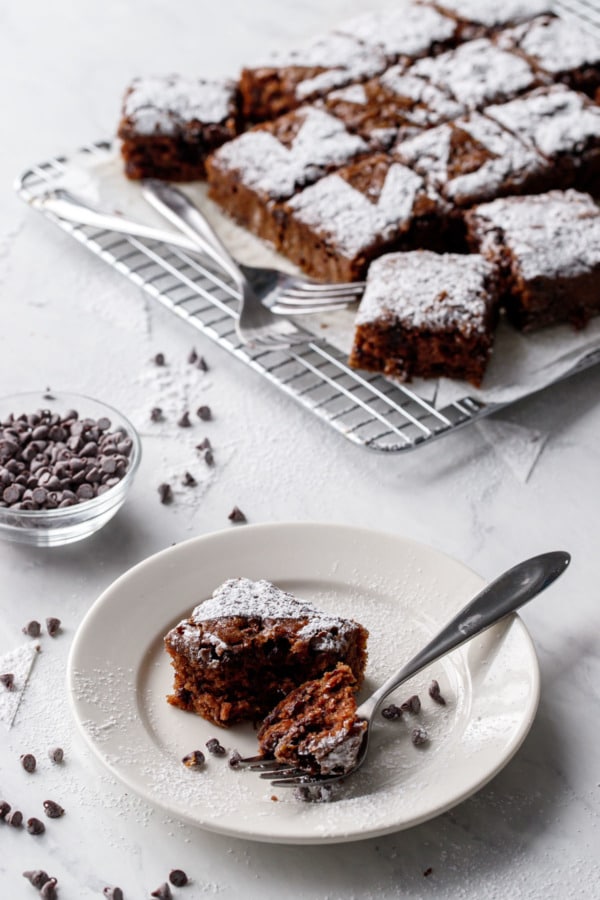 Oatmeal Chocolate Chip Snack Cake on a white plate with marble background