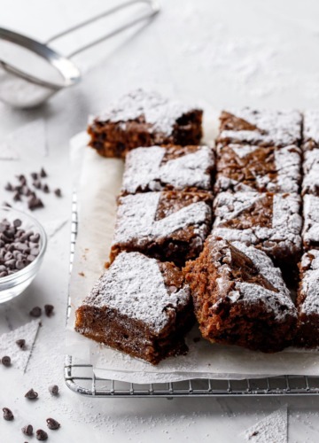 Oatmeal Chocolate Chip Snack Cake Cut into squares, on a wire baking rack